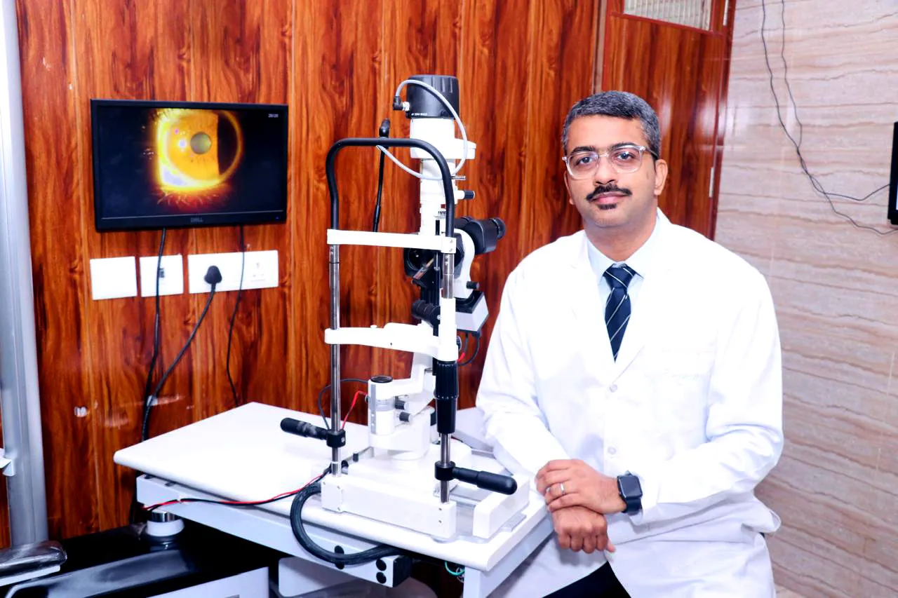 Dr. Javed H. Farooqui with a patient